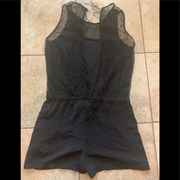 Black Romper with lace meshing at the back and draw string in the waist. - Picture 3 of 9